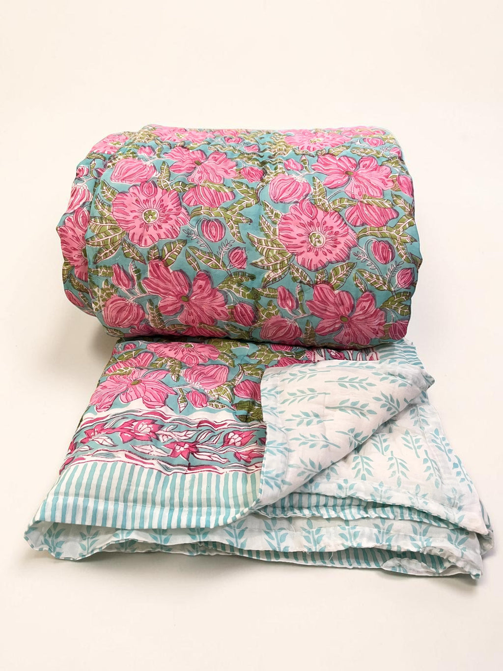 nindhaara.com hand-quilted pink floral mulmul cotton razai quilt with mint aqua field and reversible sprig print